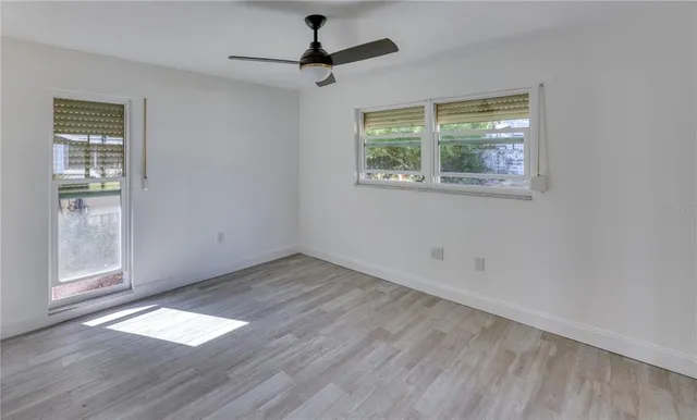 a view of an empty room with a window