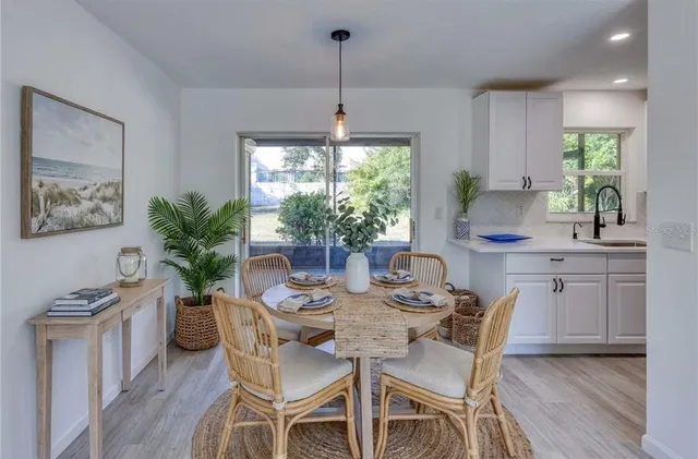 a kitchen with stainless steel appliances granite countertop a refrigerator and a stove