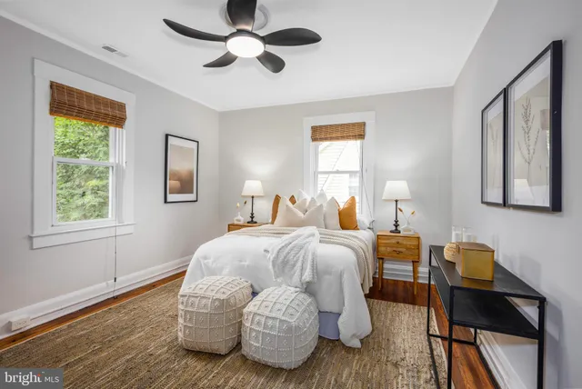 a spacious bedroom with a bed and a window