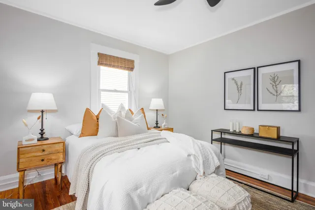 a bedroom with bed and furniture