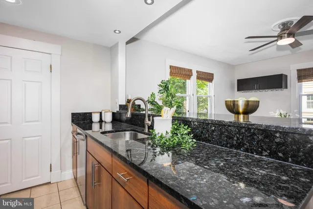 a kitchen with sink and window