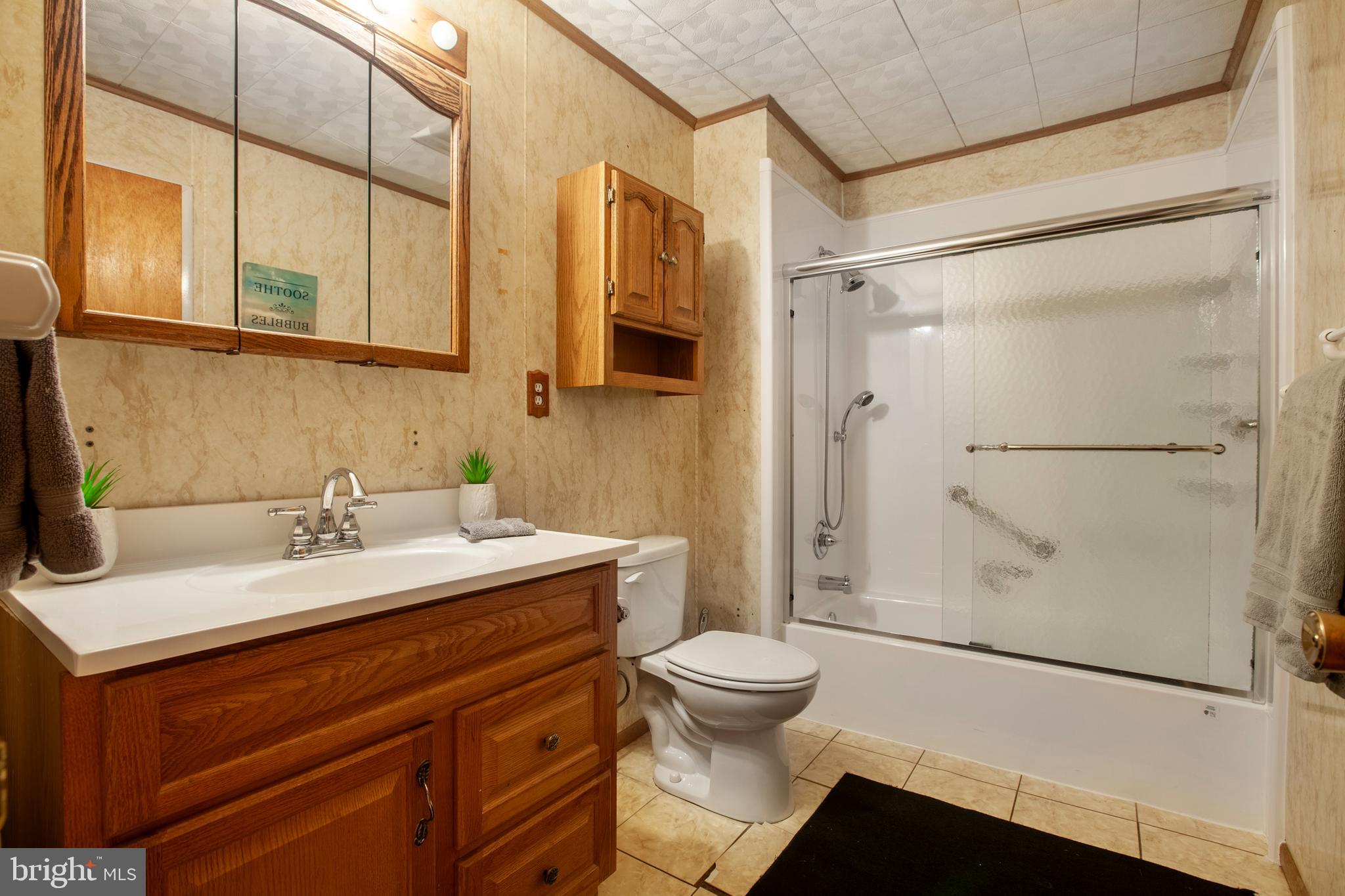 2446 Lodge Farm Road Sparrows Point, MD 21219 - Photo 16 of 52 Hall Bath with 36" Vanity, Updated Shower/Tub