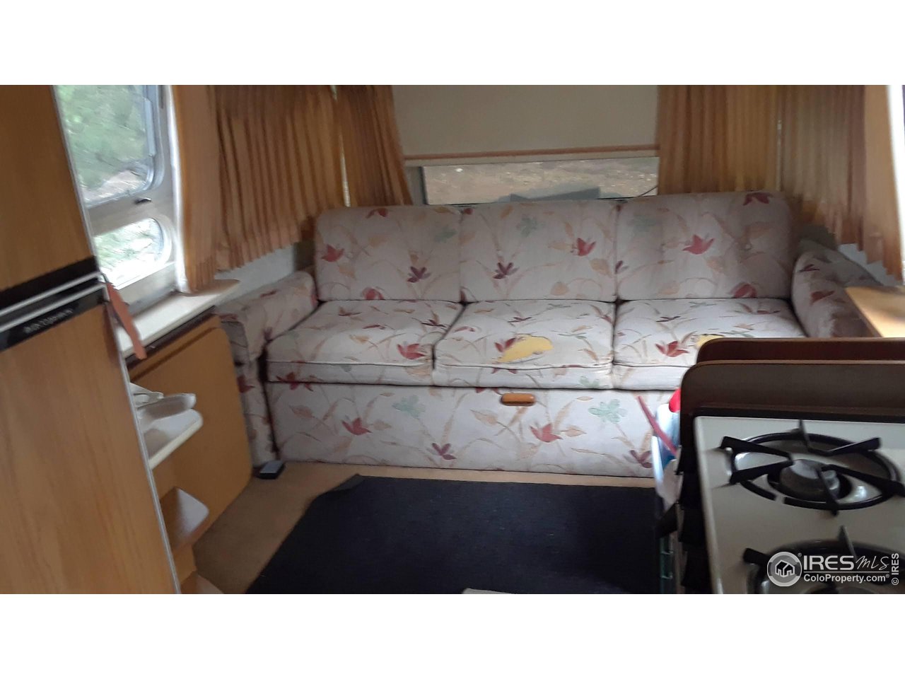 3957 Conifer Hill Road Lyons, CO 80540 - Photo 7 of 12 Pull-out sofa in front room.