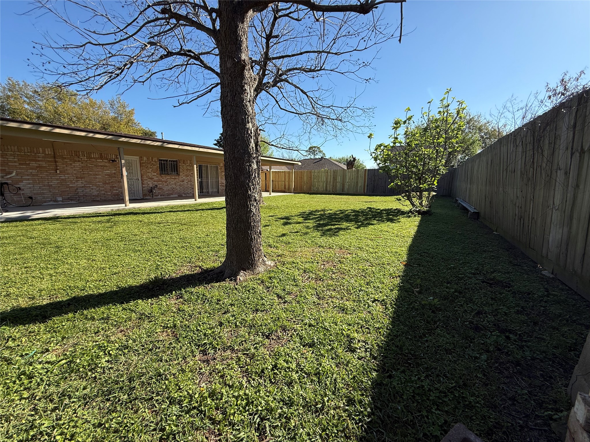 4114 Connorvale Road Houston, TX 77039 - Photo 13 of 18 a view of a backyard with large trees