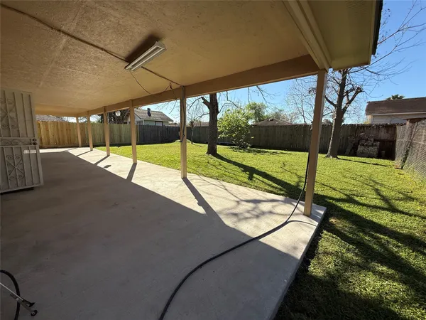 a view of swimming pool with a patio