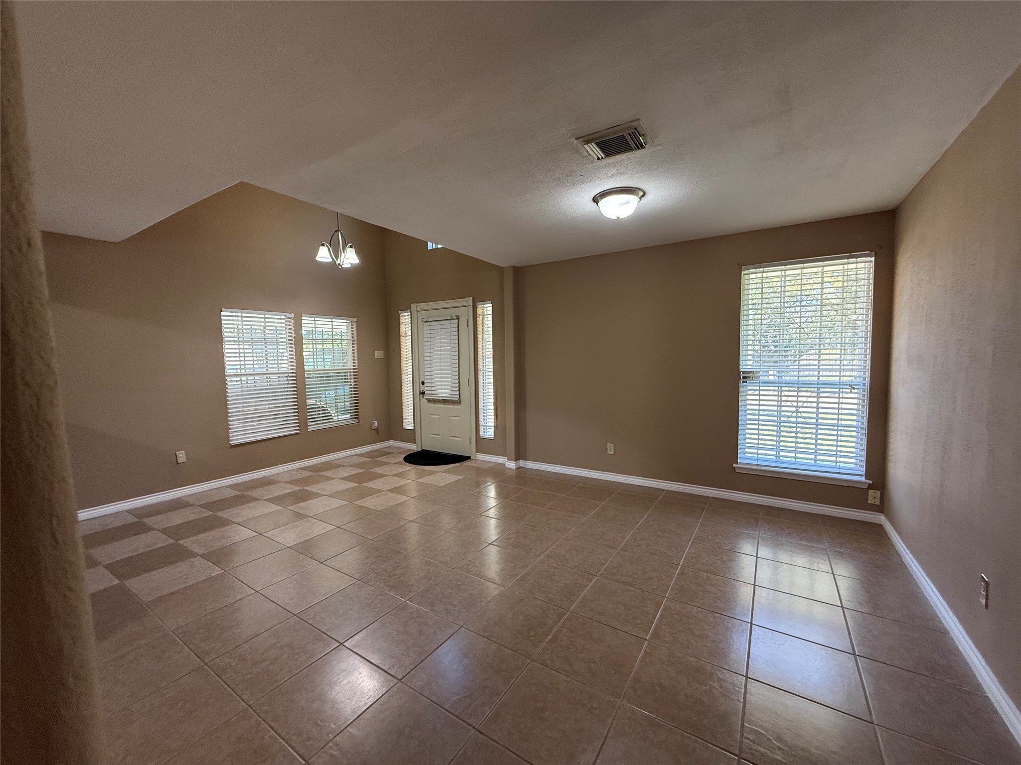 4114 Connorvale Road Houston, TX 77039 - Photo 17 of 18 a view of an empty room with window and wooden floor