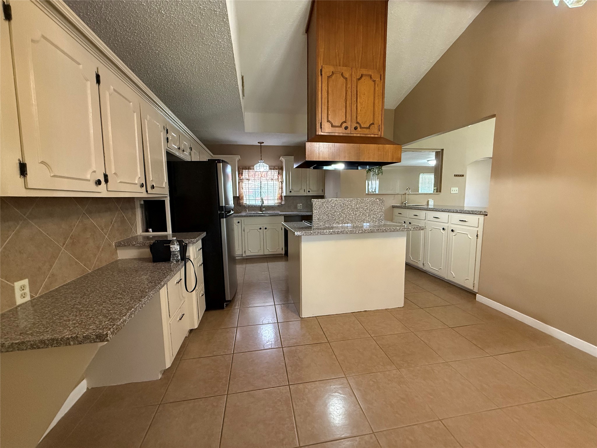 4114 Connorvale Road Houston, TX 77039 - Photo 8 of 18 a kitchen with stainless steel appliances granite countertop a sink a stove a refrigerator and cabinets