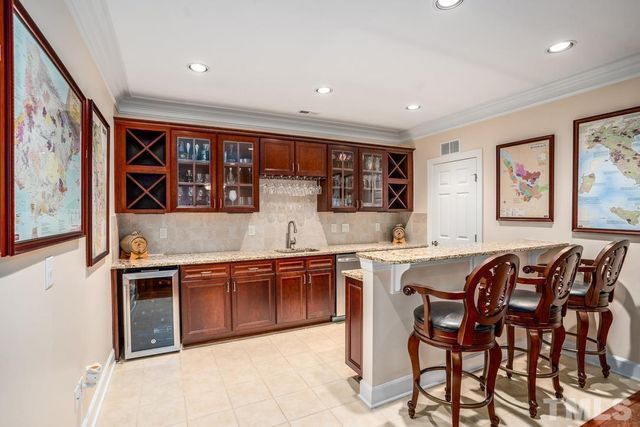 a living room with furniture ceiling fan and a rug