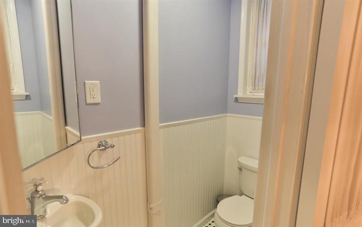 855 North 24th Street Philadelphia, PA 19130 - Photo 13 of 35 a bathroom with a granite countertop sink toilet and shower