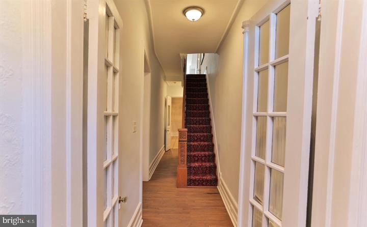 855 North 24th Street Philadelphia, PA 19130 - Photo 3 of 35 a view of a hallway with the entryway door door and staircase