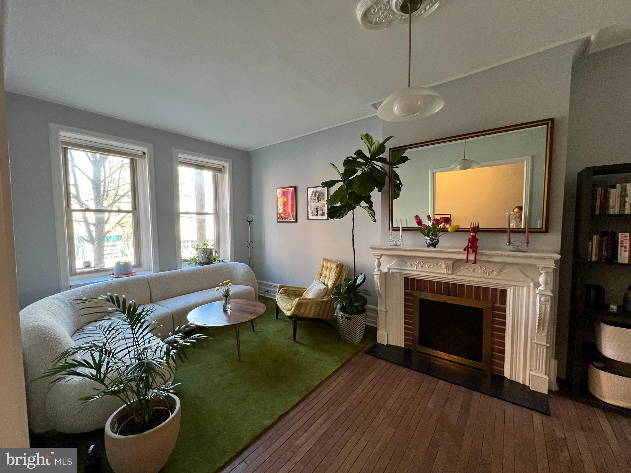 855 North 24th Street Philadelphia, PA 19130 - Photo 6 of 35 a living room with furniture and a fireplace