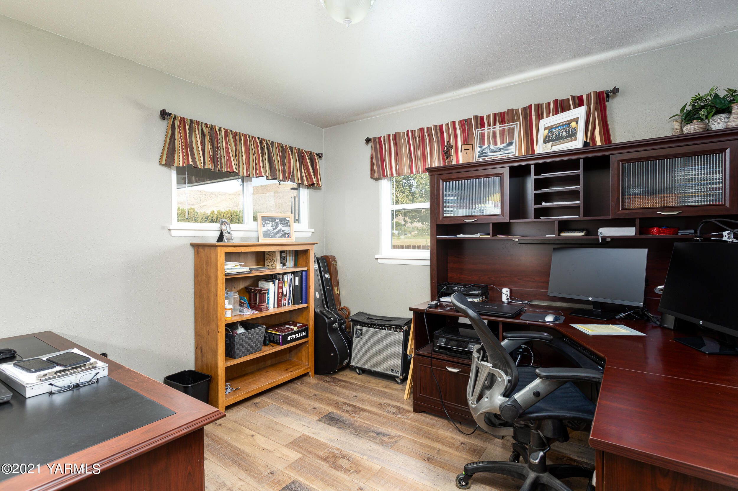 550 McPhee Road Naches, WA 98937 - Photo 15 of 28 a view of a workspace with furniture and a window