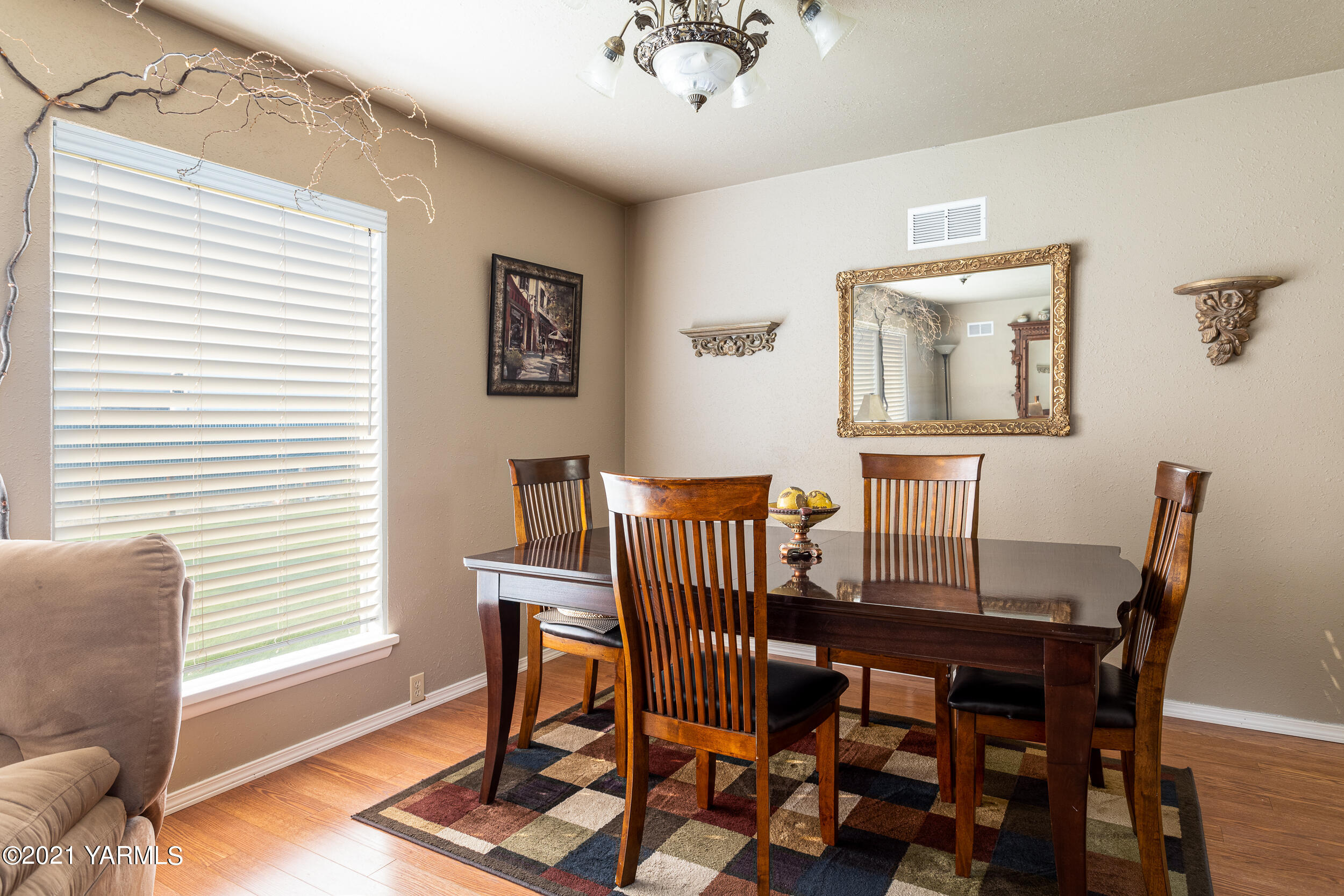 550 McPhee Road Naches, WA 98937 - Photo 9 of 28 a view of a dining room with furniture and wooden floor
