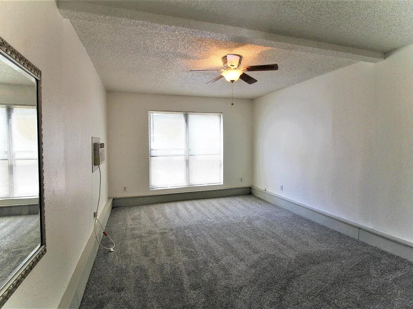 2216 30th Street, Unit REAR Lubbock, TX 79411 - Photo 11 of 14 a view of an empty room with a window