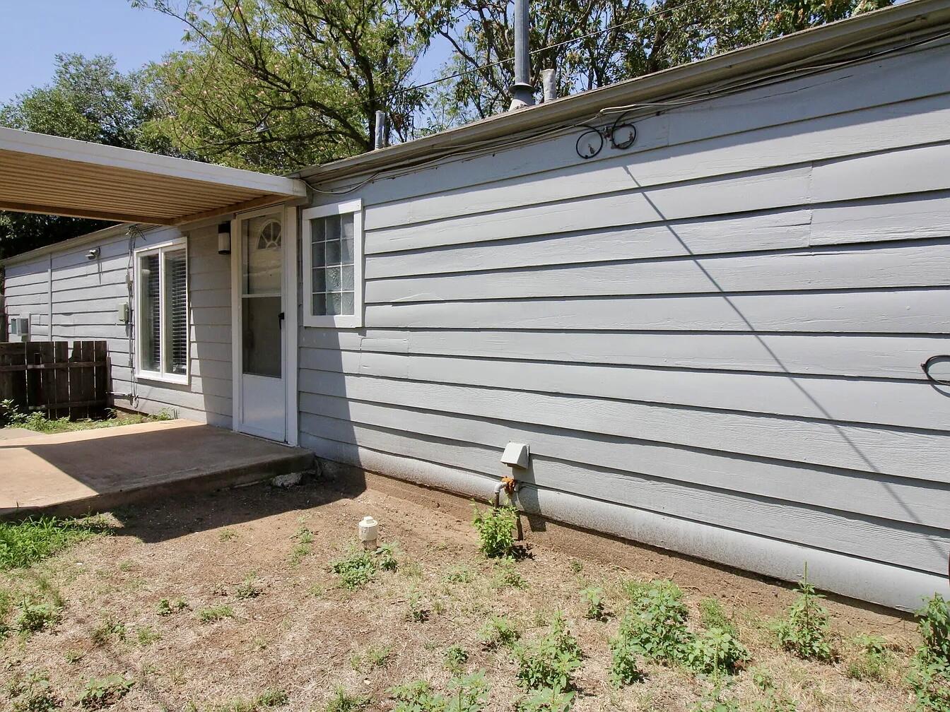 2216 30th Street, Unit REAR Lubbock, TX 79411 - Photo 3 of 14 a view of a backyard