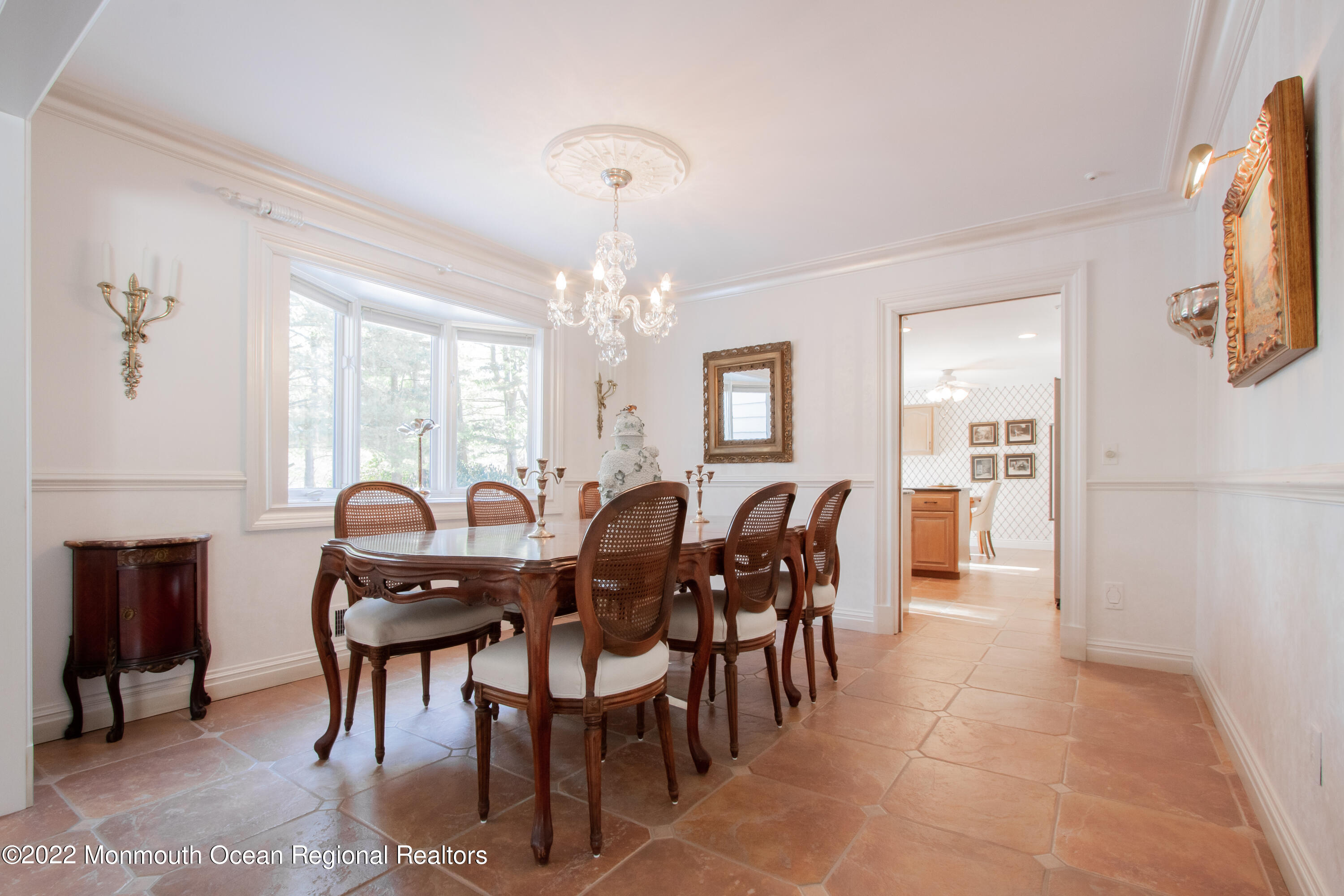 2 Woods End Road Rumson, NJ 07760 - Photo 12 of 35 a view of a dining room with furniture a chandelier and wooden floor