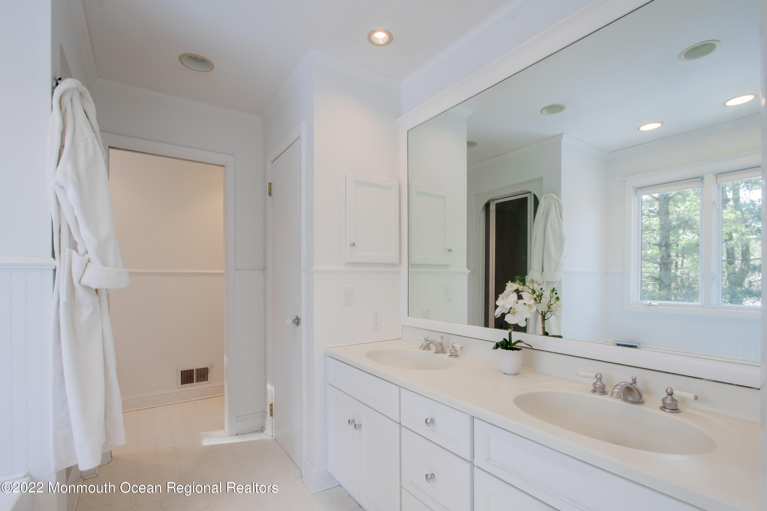 2 Woods End Road Rumson, NJ 07760 - Photo 18 of 35 a bathroom with a double vanity sink and mirror