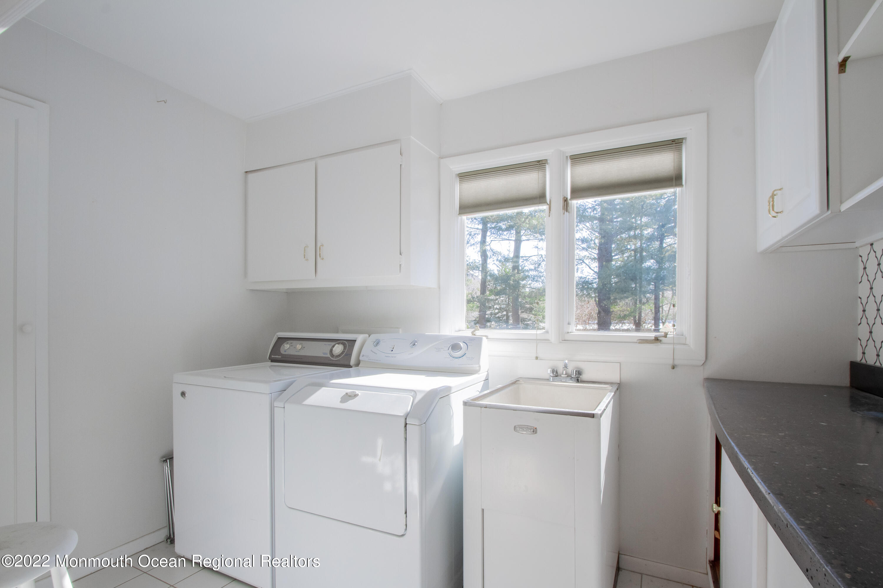 2 Woods End Road Rumson, NJ 07760 - Photo 28 of 35 a view of washer and dryer with kitchen countertops
