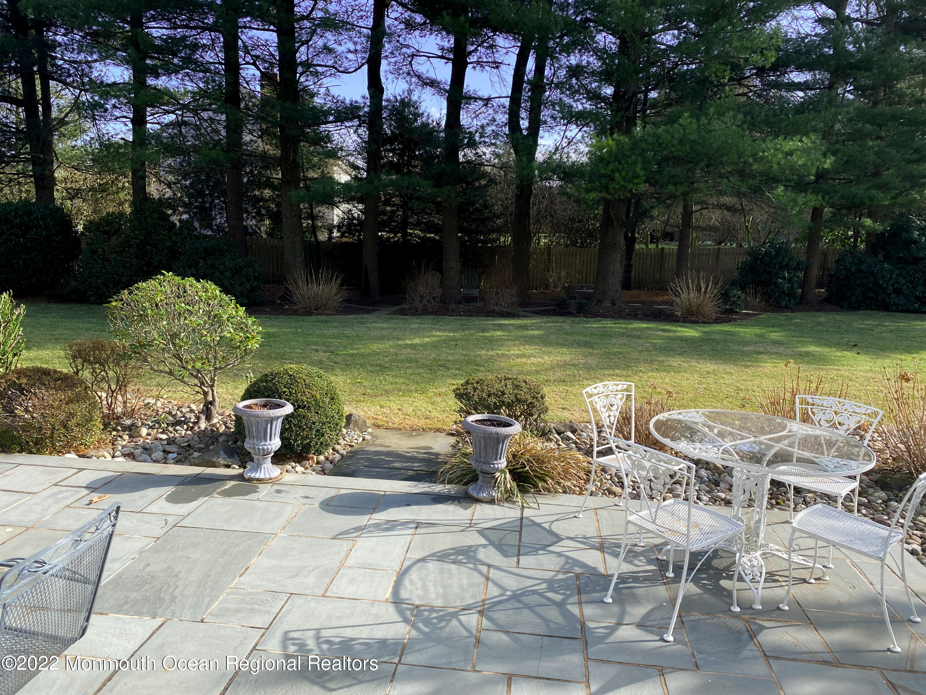 2 Woods End Road Rumson, NJ 07760 - Photo 29 of 35 a view of a swimming pool with lawn chairs and a fire pit