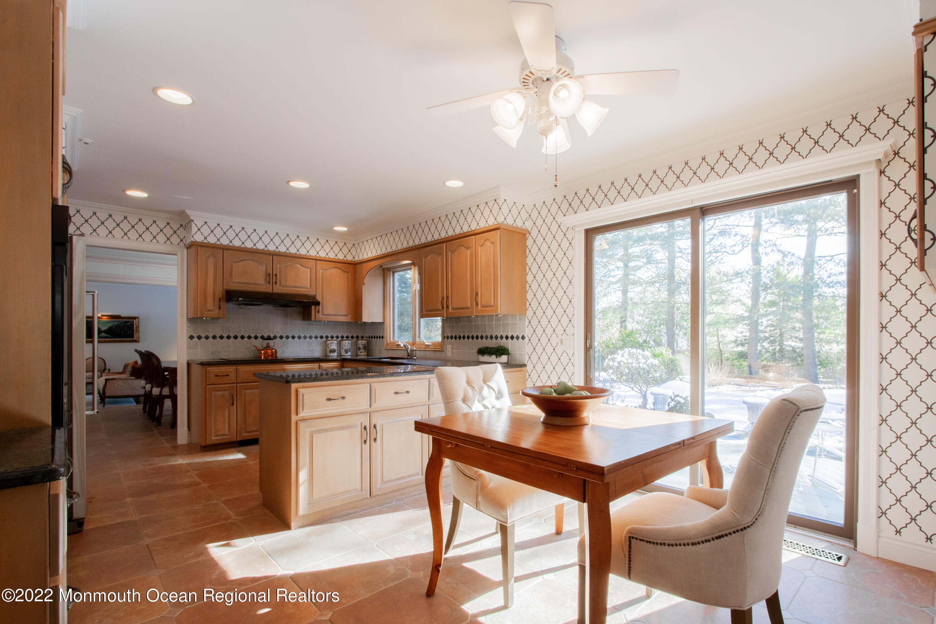 2 Woods End Road Rumson, NJ 07760 - Photo 7 of 35 a kitchen with stainless steel appliances granite countertop a stove top oven a sink dishwasher a dining table and chairs with wooden floor
