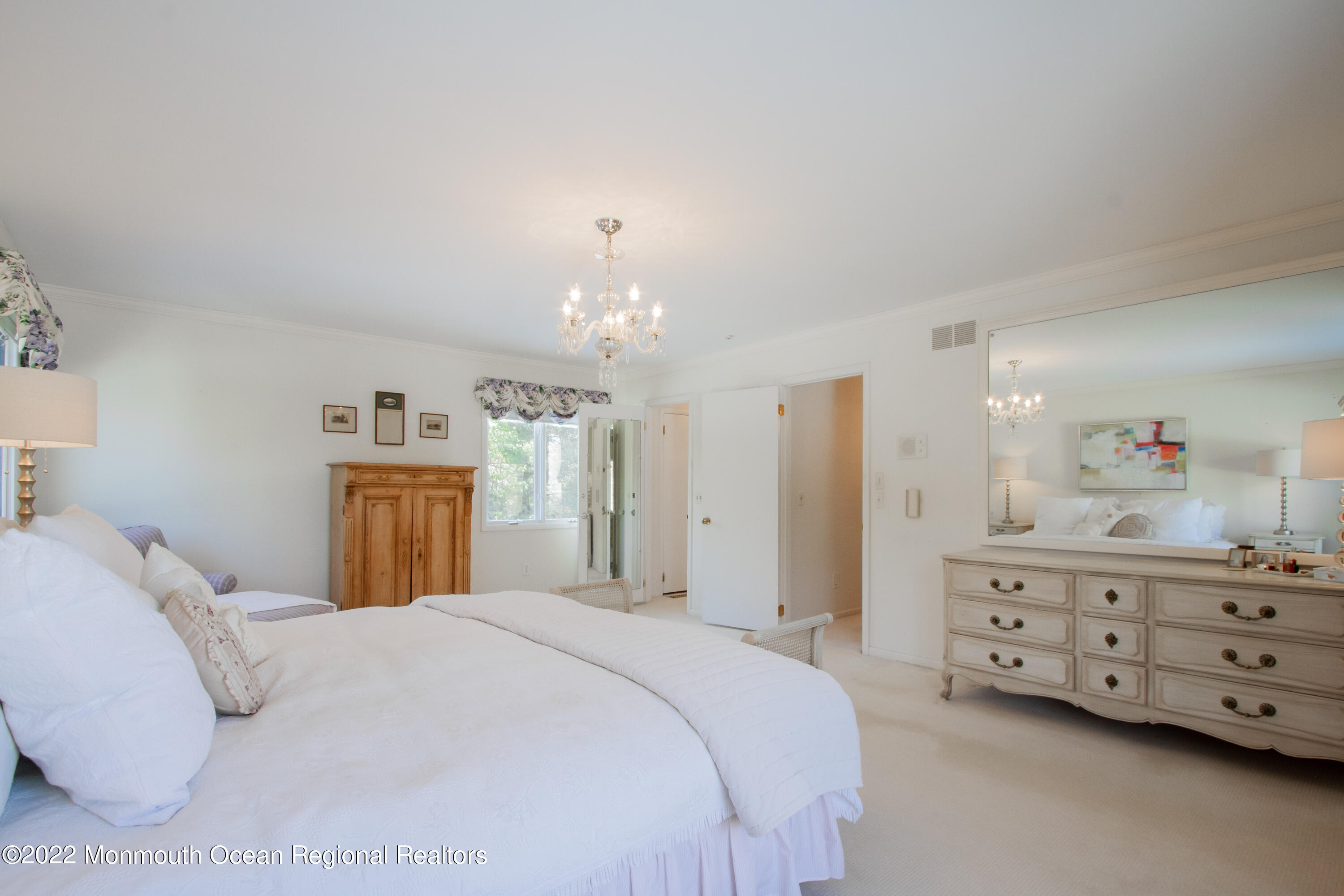 2 Woods End Road Rumson, NJ 07760 - Photo 9 of 35 a bedroom with a bed and a cabinets