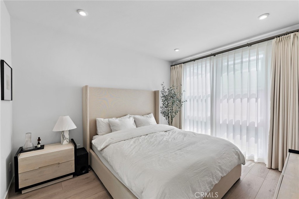 1826 West Bushell Street Anaheim, CA 92805 - Photo 18 of 30 a bedroom with a bed and a large window