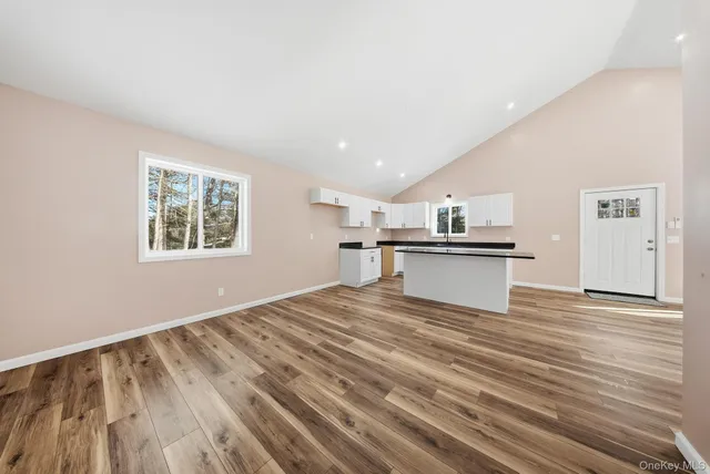 a view of kitchen with wooden floor