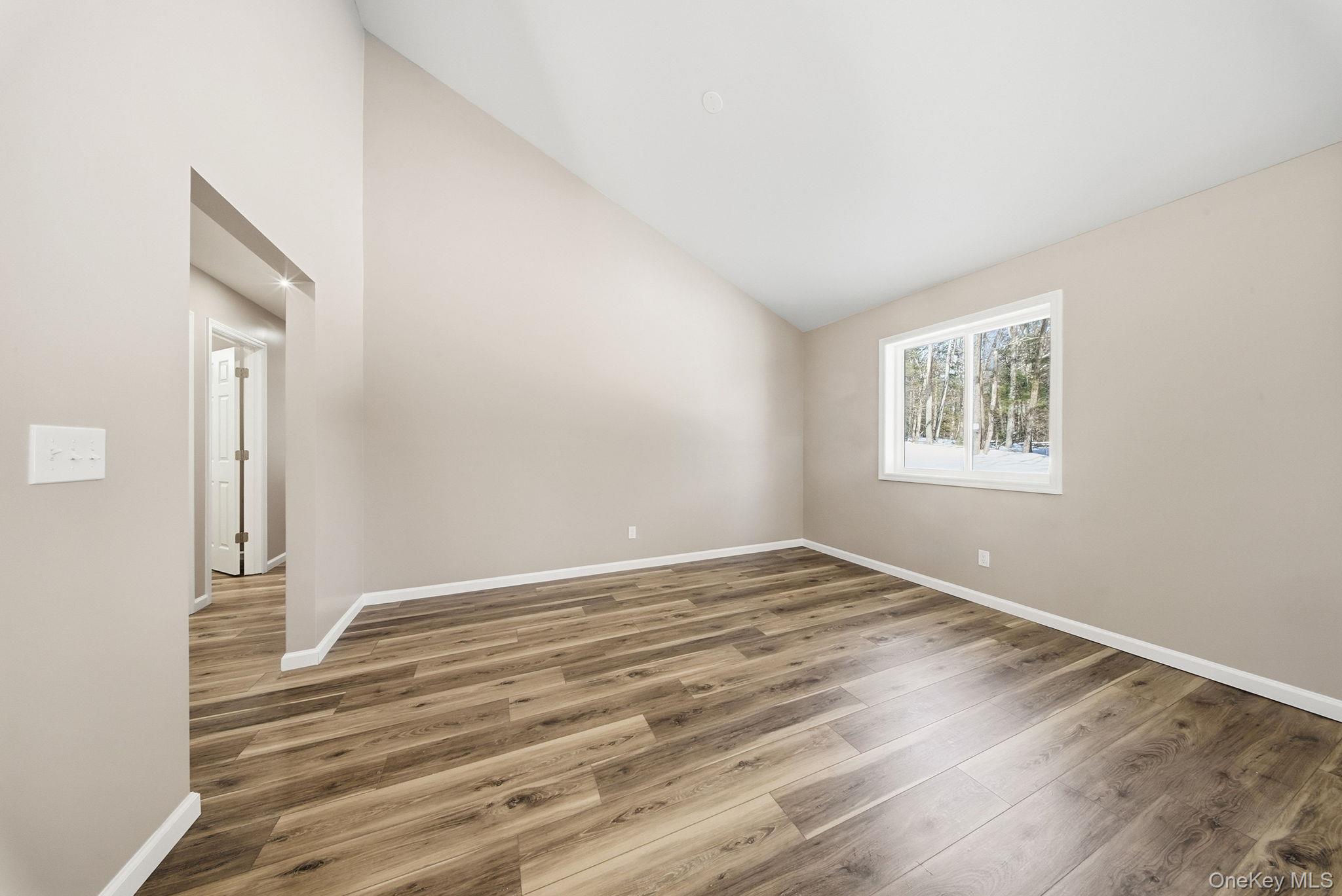 943 State Rte 55 Eldred, NY 12732 - Photo 12 of 33 a view of empty room with wooden floor and fan