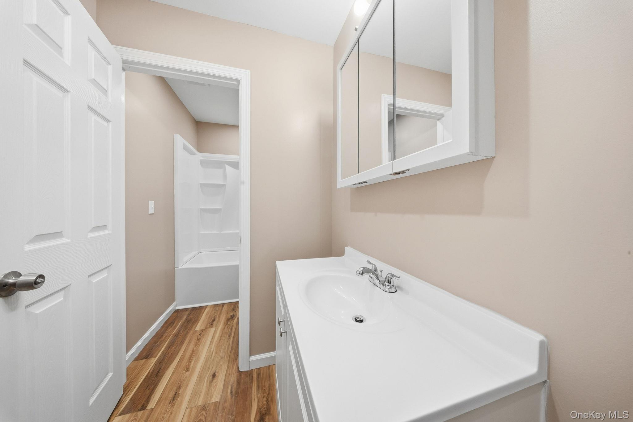 943 State Rte 55 Eldred, NY 12732 - Photo 13 of 33 a bathroom with a sink and a bathtub