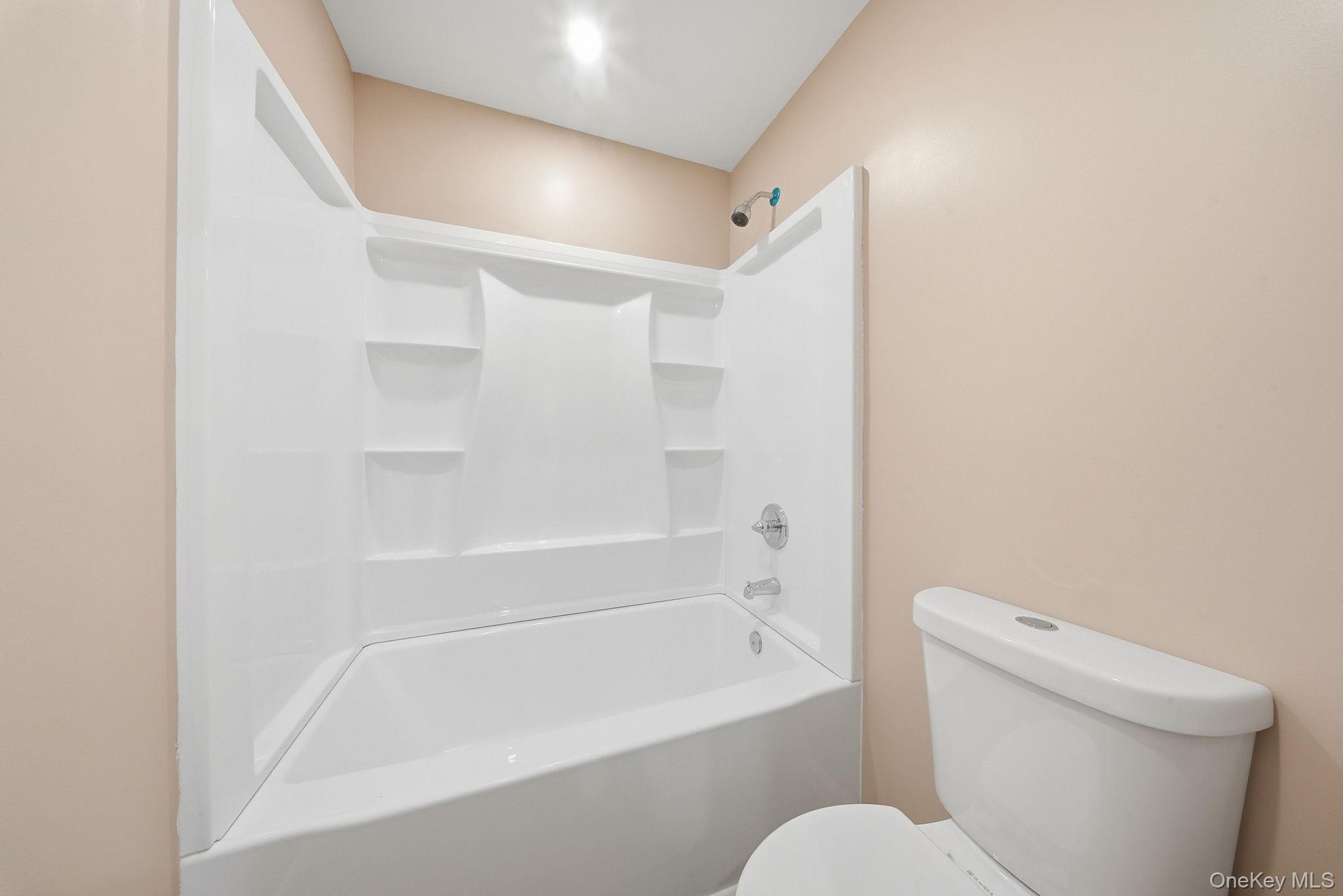 943 State Rte 55 Eldred, NY 12732 - Photo 16 of 33 a bathroom with a toilet and a bathtub