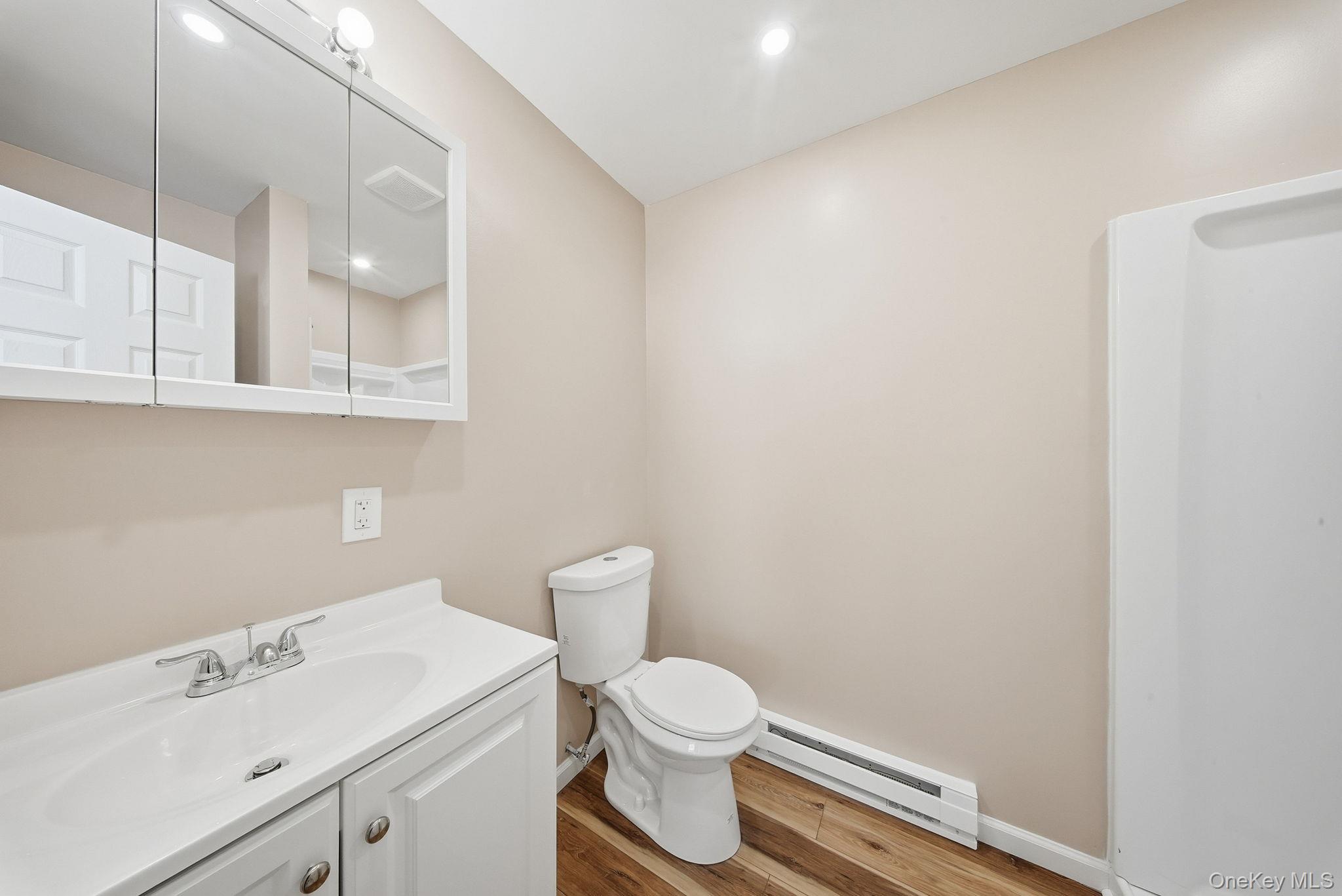 943 State Rte 55 Eldred, NY 12732 - Photo 23 of 33 a white toilet sitting next to a bathroom sink