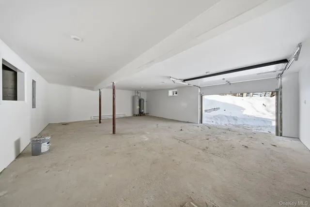 a view of a big room with window and refrigerator