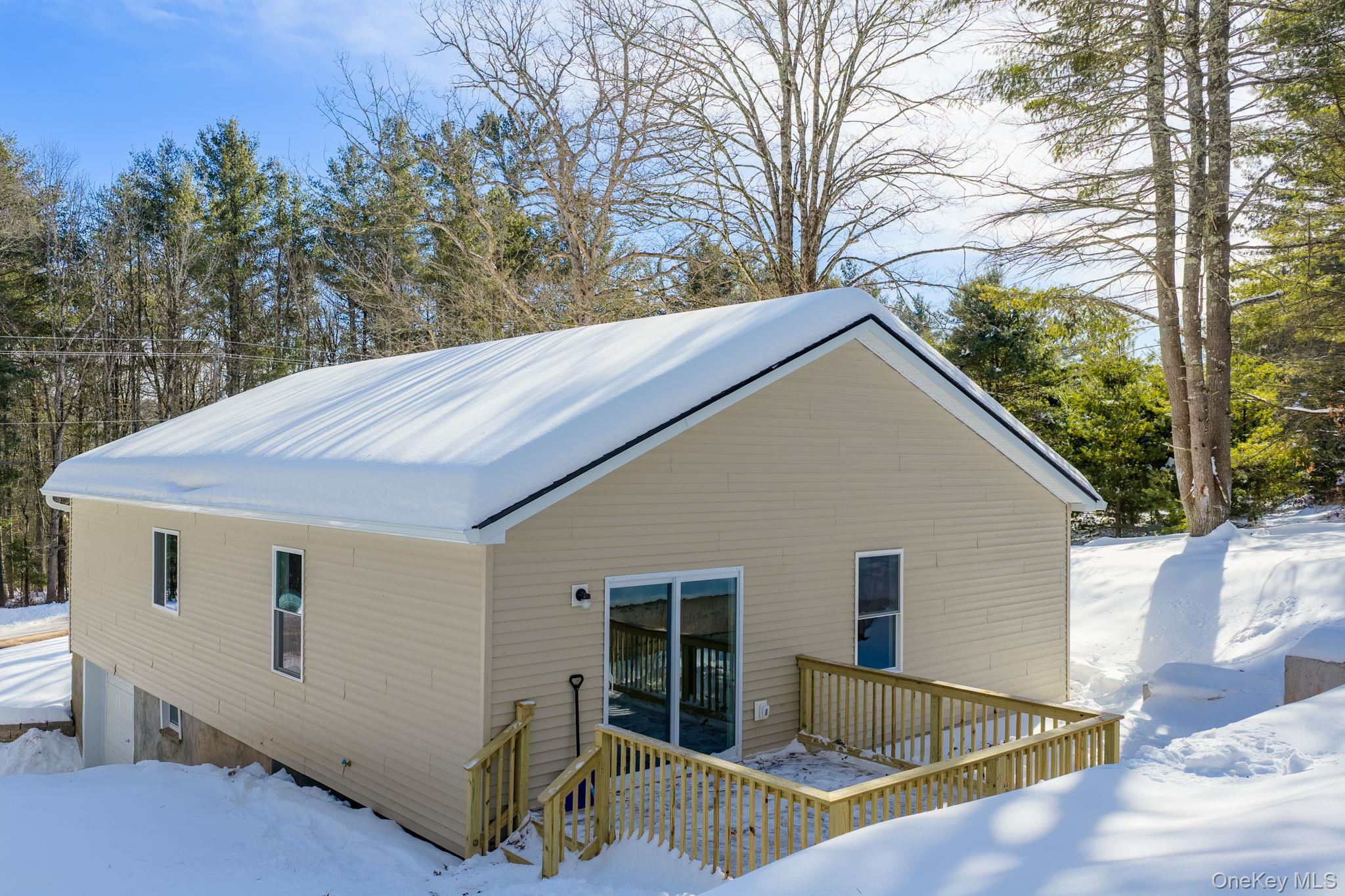 943 State Rte 55 Eldred, NY 12732 - Photo 29 of 33 a view of backyard with large tree and wooden fence
