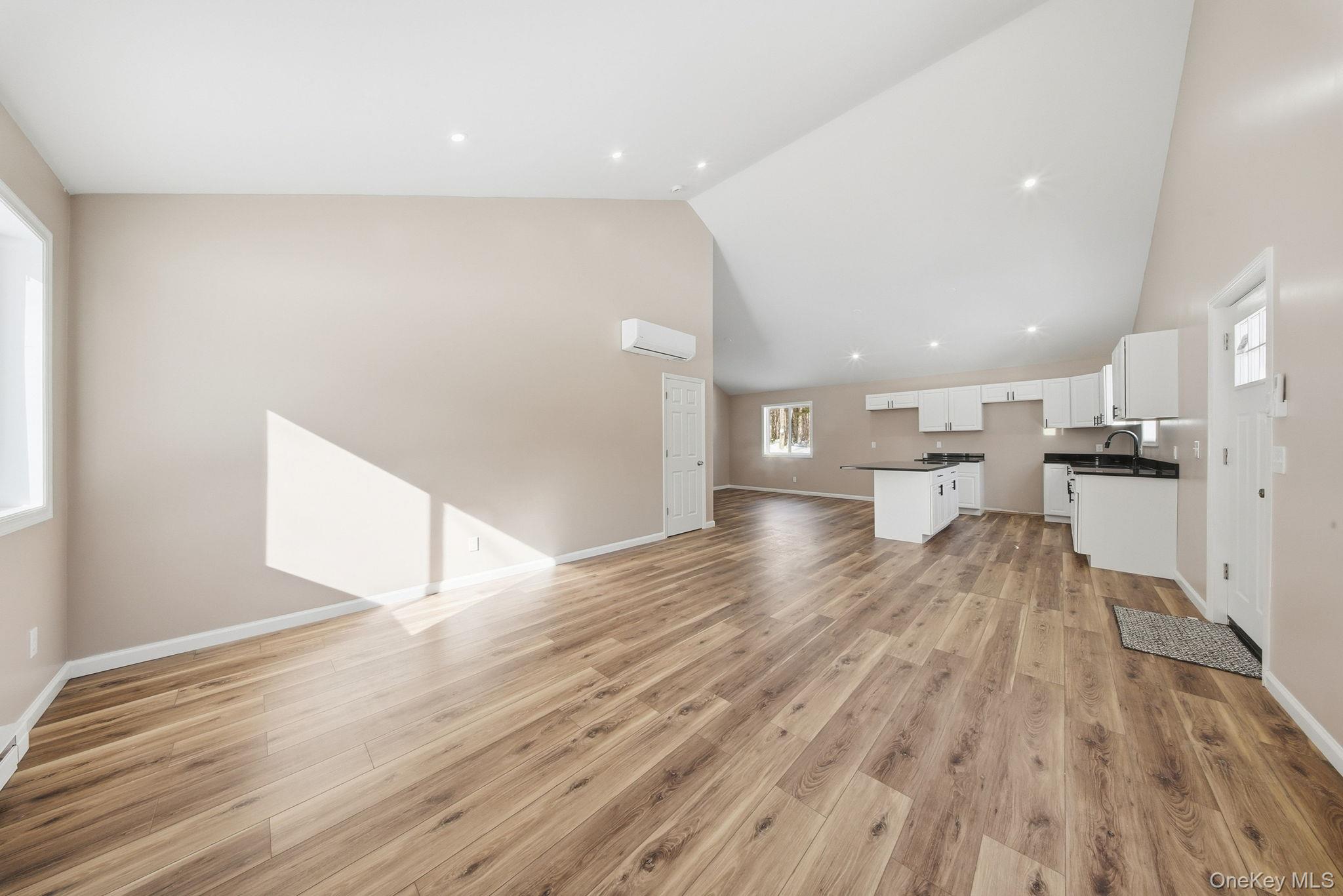 943 State Rte 55 Eldred, NY 12732 - Photo 4 of 33 a view of empty room with wooden floor