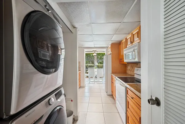 a hallway with a washer and dryer
