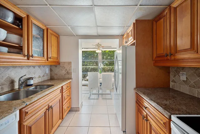 a kitchen that has a sink and a stove