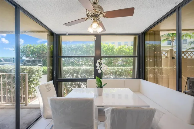 a dining room with a large window and table