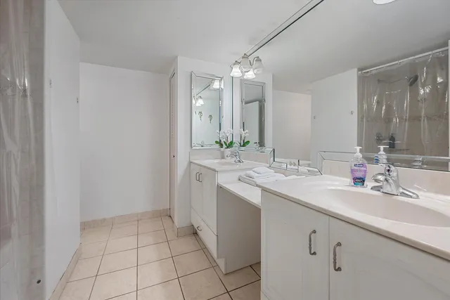 a bathroom with a sink a vanity and a mirror
