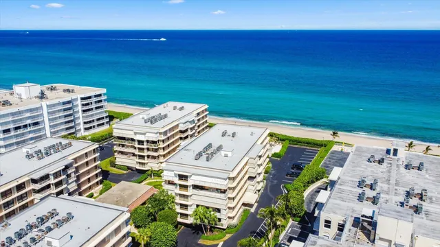 a view of a building next to a big yard