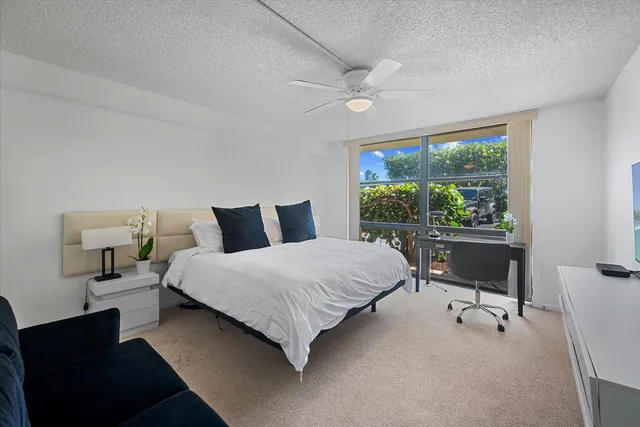 a bedroom with a bed and a desk