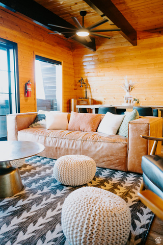 1413 Basel Drive Midway, UT 84049 - Photo 14 of 137 Living room with wooden walls, a wood ceiling with exposed beams, and a ceiling fan