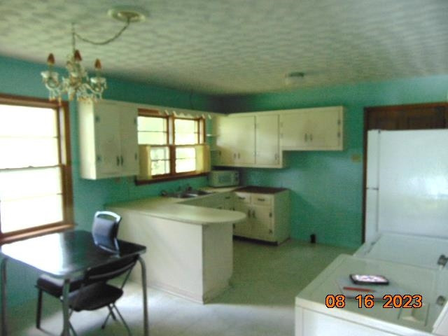 829 Beacon Road Parsons, TN 38363 - Photo 12 of 14 a kitchen with a sink and a refrigerator