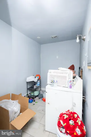a storage room with washer and dryer