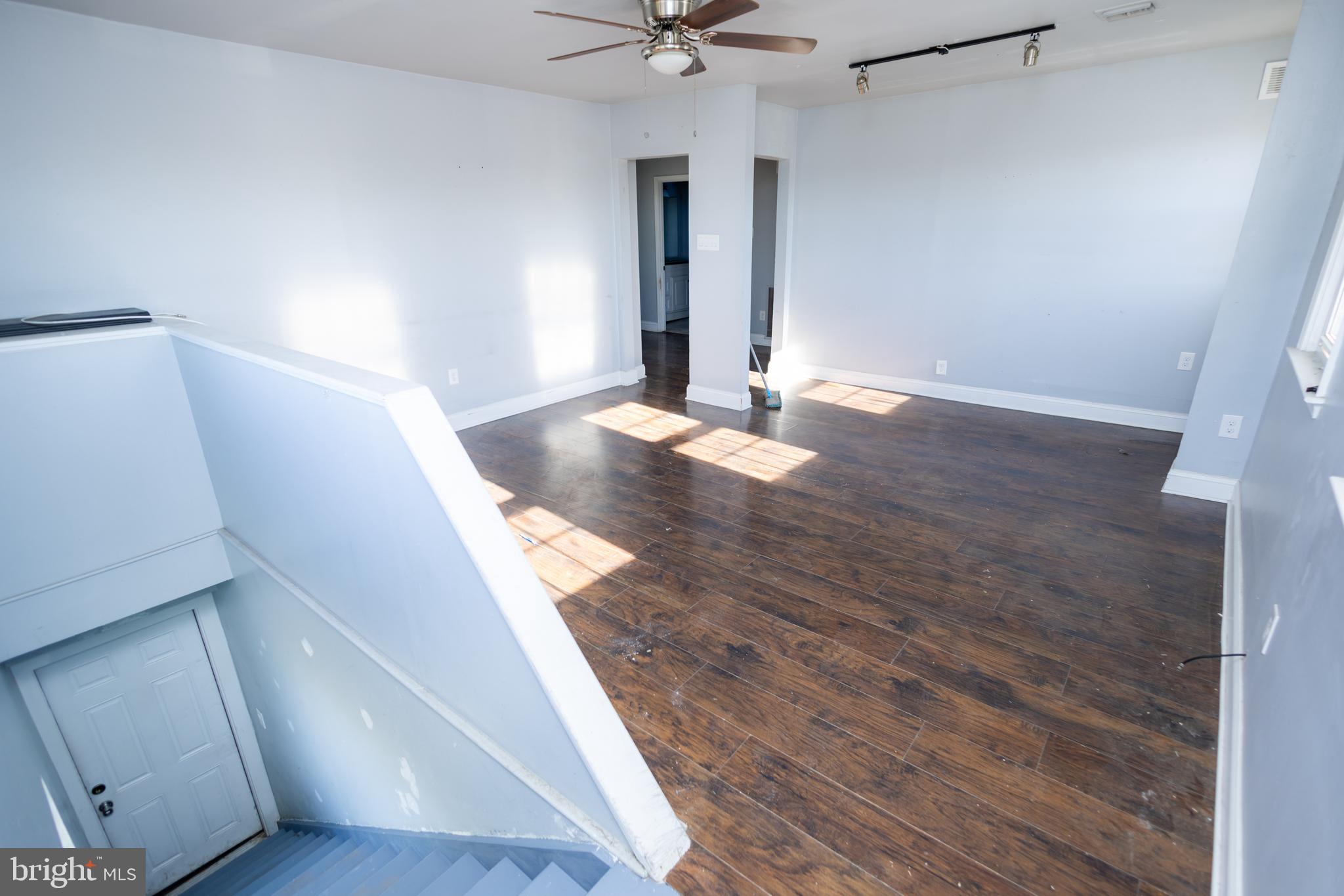 3201 Morrell Avenue, Unit 3 Philadelphia, PA 19114 - Photo 32 of 42 a view of a livingroom with wooden floor and a ceiling fan
