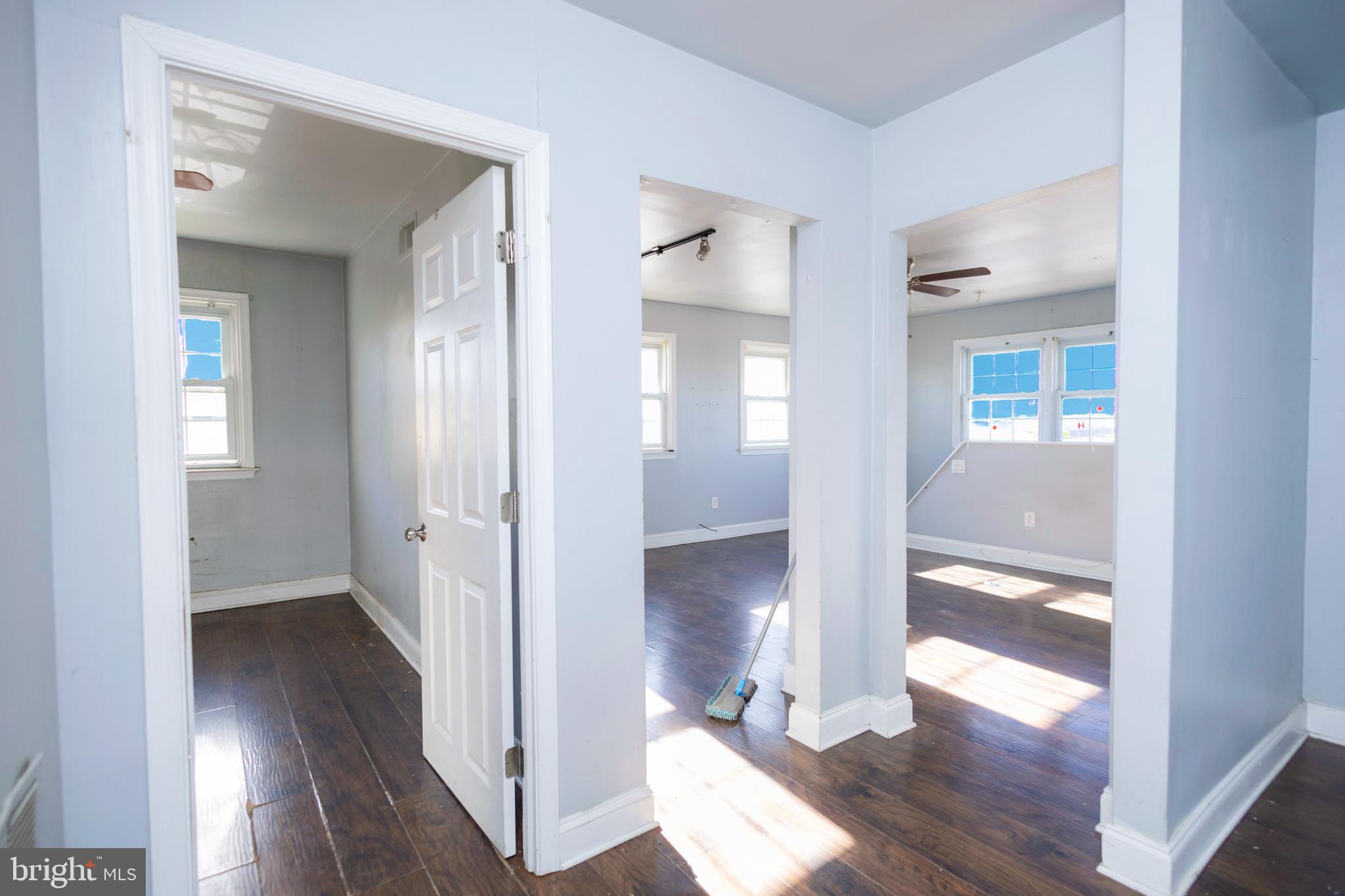 3201 Morrell Avenue, Unit 3 Philadelphia, PA 19114 - Photo 33 of 42 a view of a hallway with wooden floor and a living room