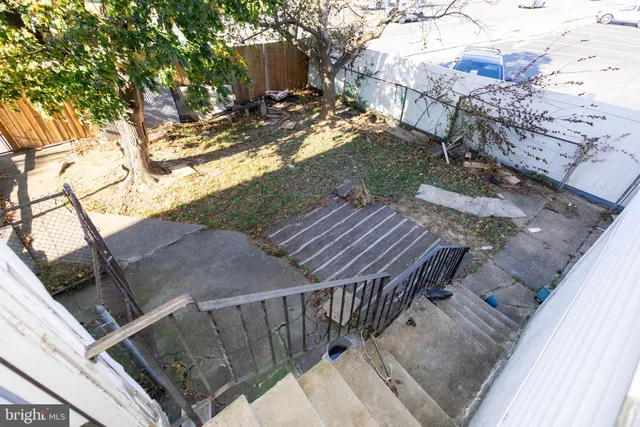 a view of backyard with deck and seating area