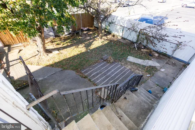 a view of backyard with deck and seating area