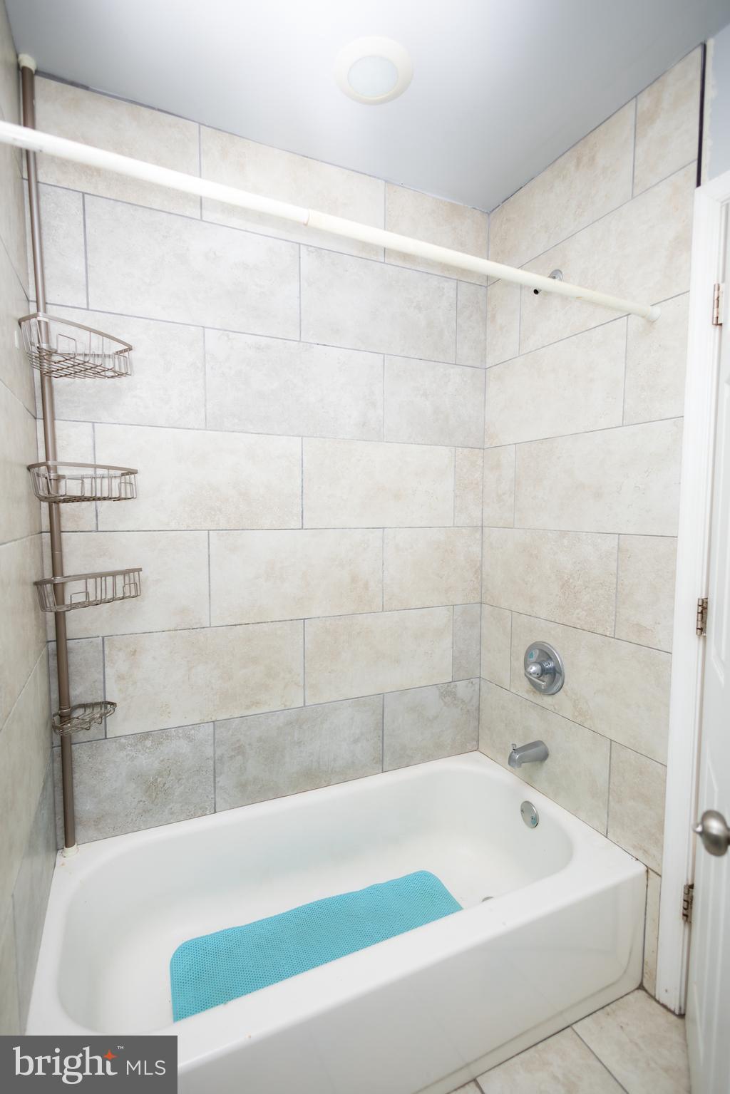 3201 Morrell Avenue, Unit 3 Philadelphia, PA 19114 - Photo 8 of 42 a bathroom with a bathtub and shower
