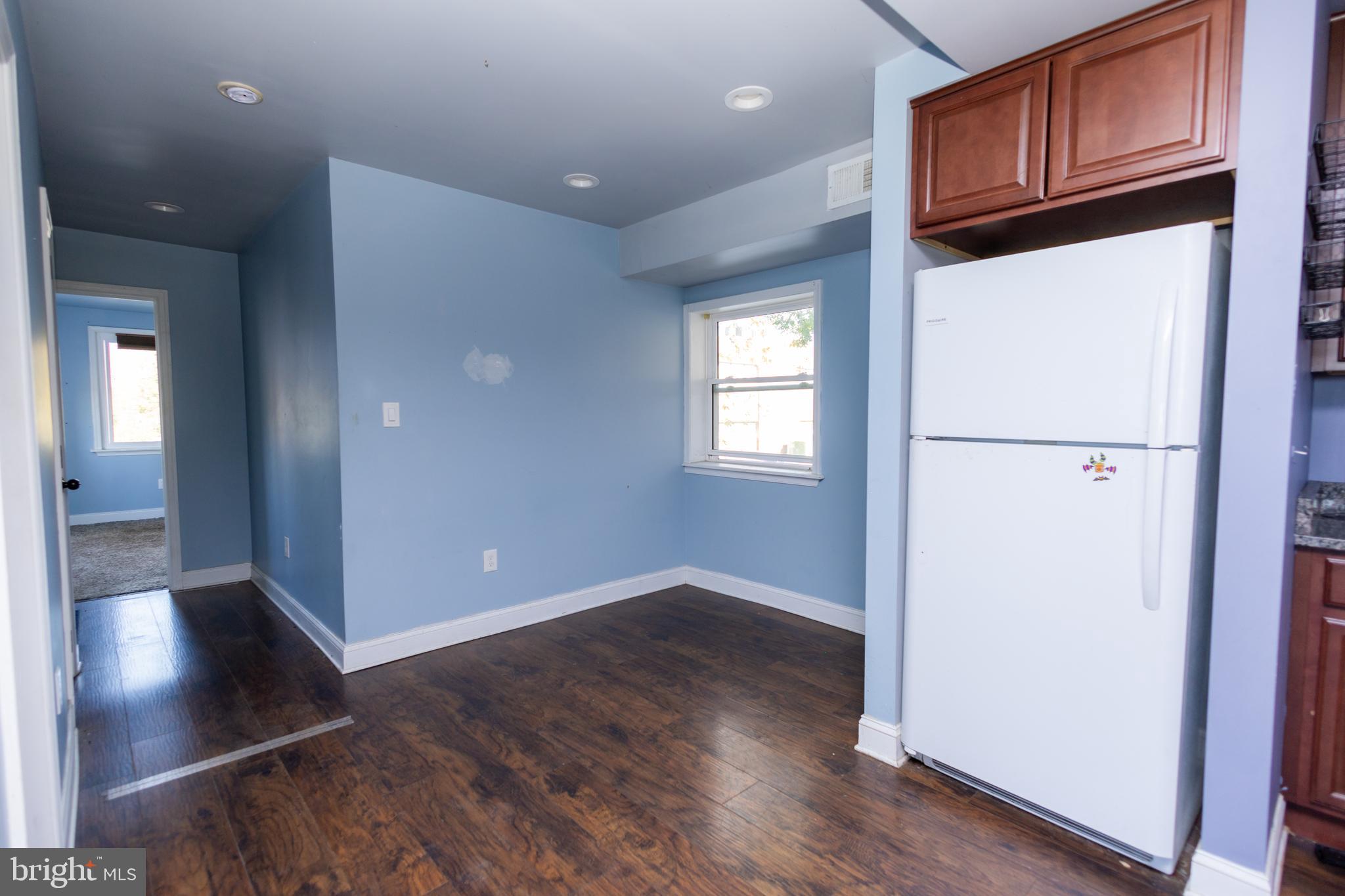 3201 Morrell Avenue, Unit 3 Philadelphia, PA 19114 - Photo 9 of 42 a view of a kitchen with wooden floor and cabinets