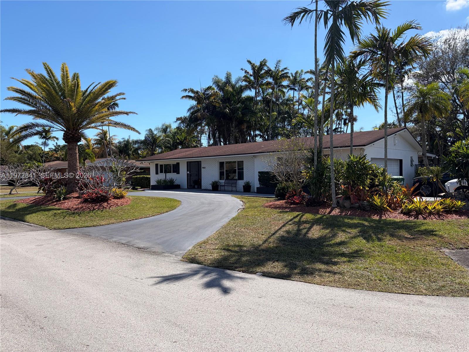 9860 Southwest 122nd Street Miami, FL 33176 - Photo 1 of 27 a view of a house with swimming pool and sitting area